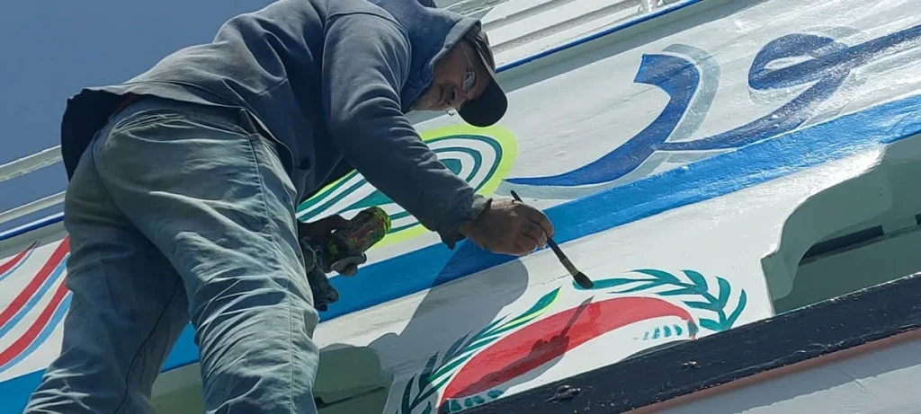 Upon the Crest of the Sea: The Calligraphers Who Paint Dreams and Lineage onto the Hull The Calligraphers of the Vessels - Photo: Helmy Yassin