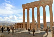 Lebanese Army soldiers stand guard before the six iconic columns of the Temple of Jupiter.
