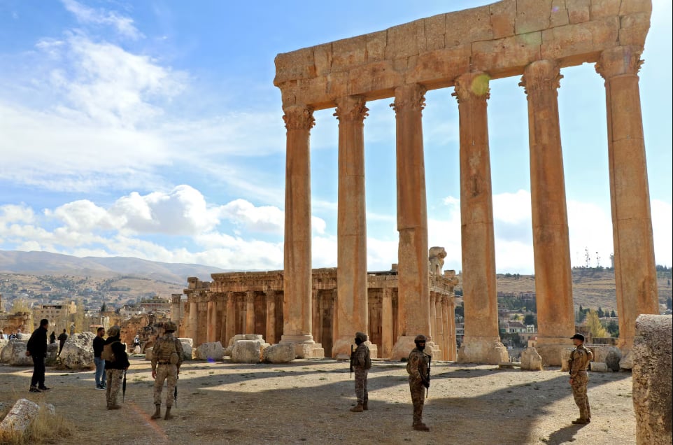 Shadows Over Antiquity: The Occupation’s Assault on Lebanon’s Living History Lebanese Army soldiers stand guard before the six iconic columns of the Temple of Jupiter.