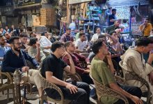 The vibrant energy of Assiut's coffeehouses during match night - Photo: Jasmine Mehana